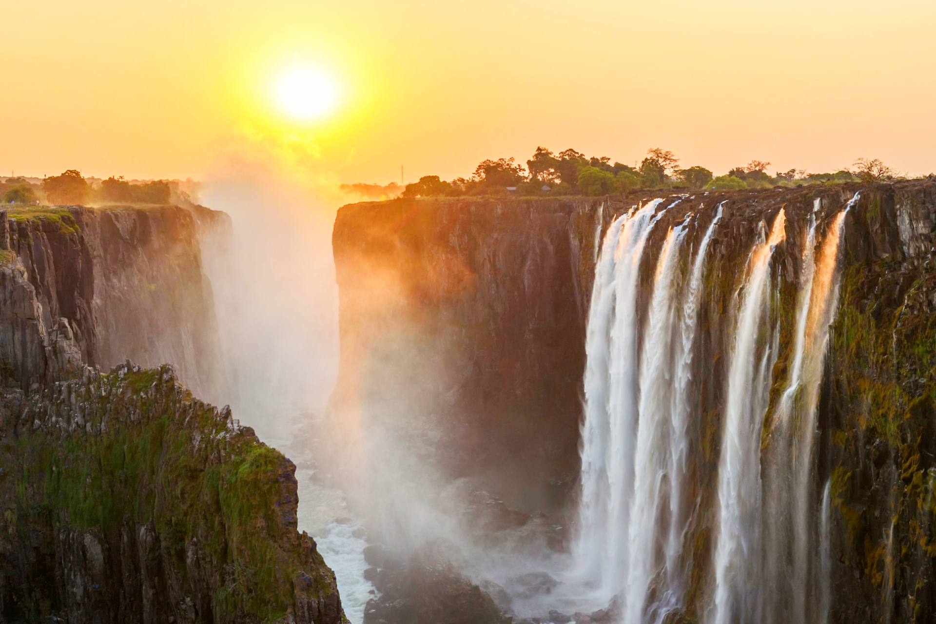 A beautiful view of the majestic Victoria Falls during sunrise